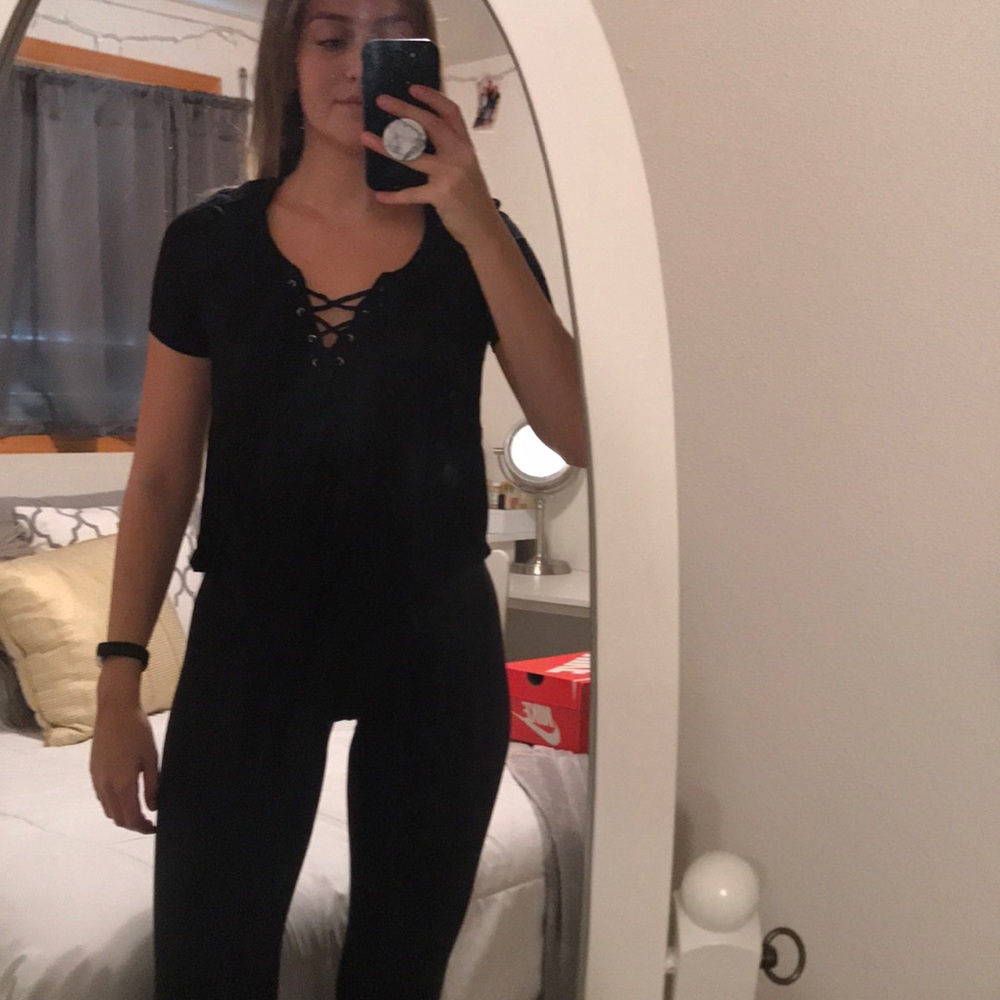 Crisscross in the front of black T-shirt